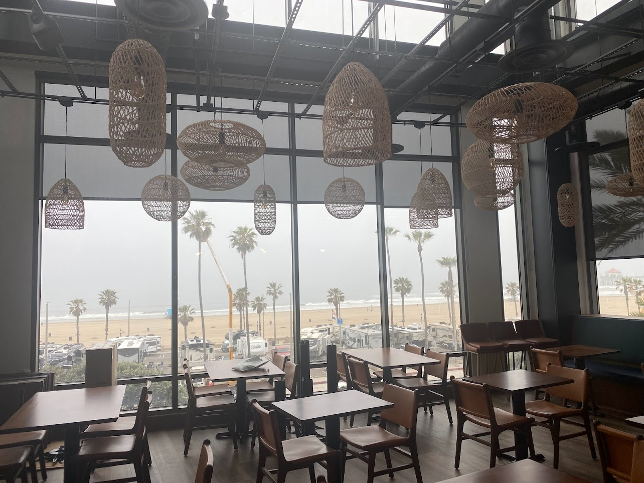 Beachfront restaurant with wicker pendant lighting